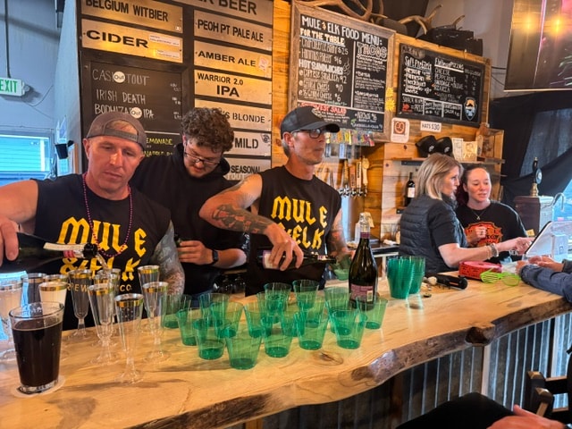 Mule & Elk crew pouring drinks at the bar