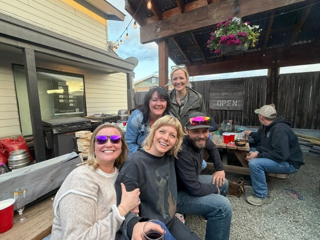 Friends hanging out on the Mule & Elk patio